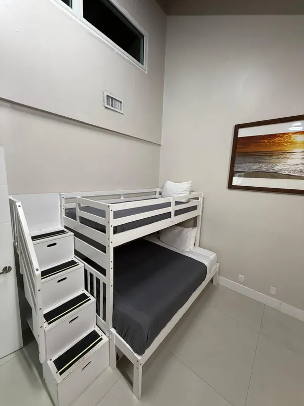 The same bunk bed neatly made after the turnover