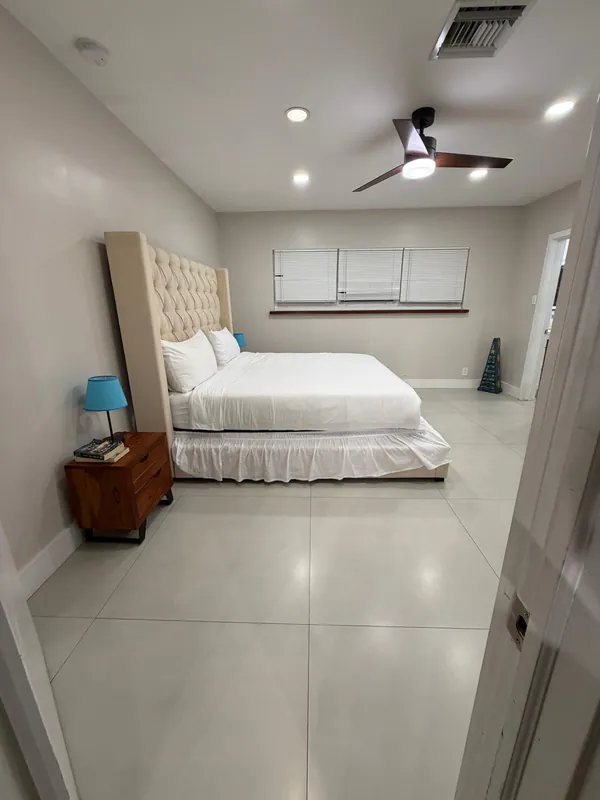 The same bedroom with the bed made after the turnover